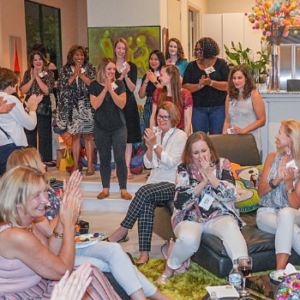 This image is of the Great Girls Network August 2019 Summer gathering. Picture of a large group of ladies clapping and cheering